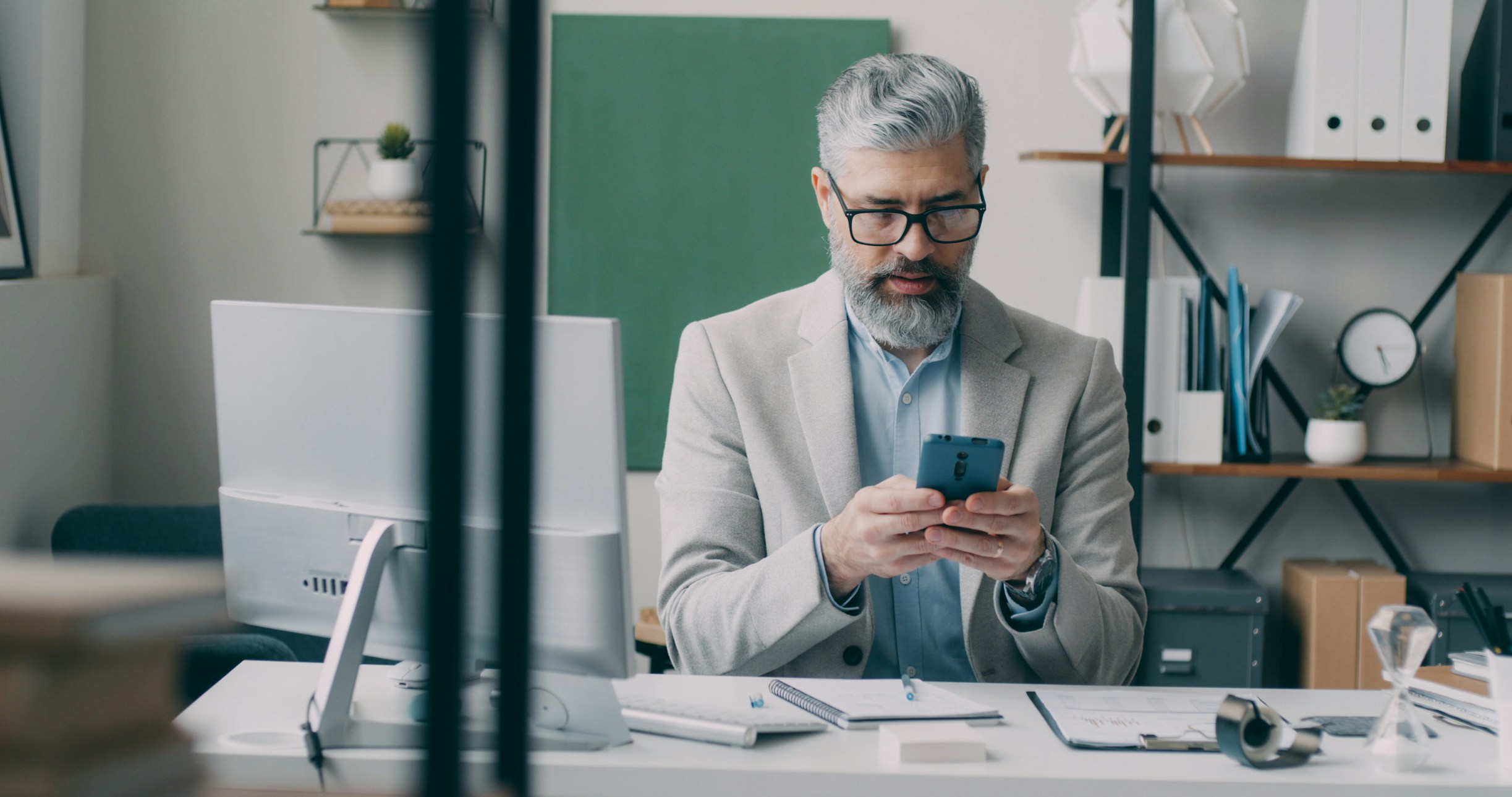 Attorney reviewing an ARIA intake notification on his phone