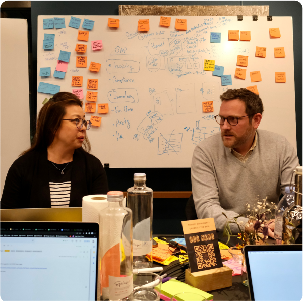 construction software development team a team developing custom construction software in an office